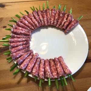 Salami roll ups on the plate